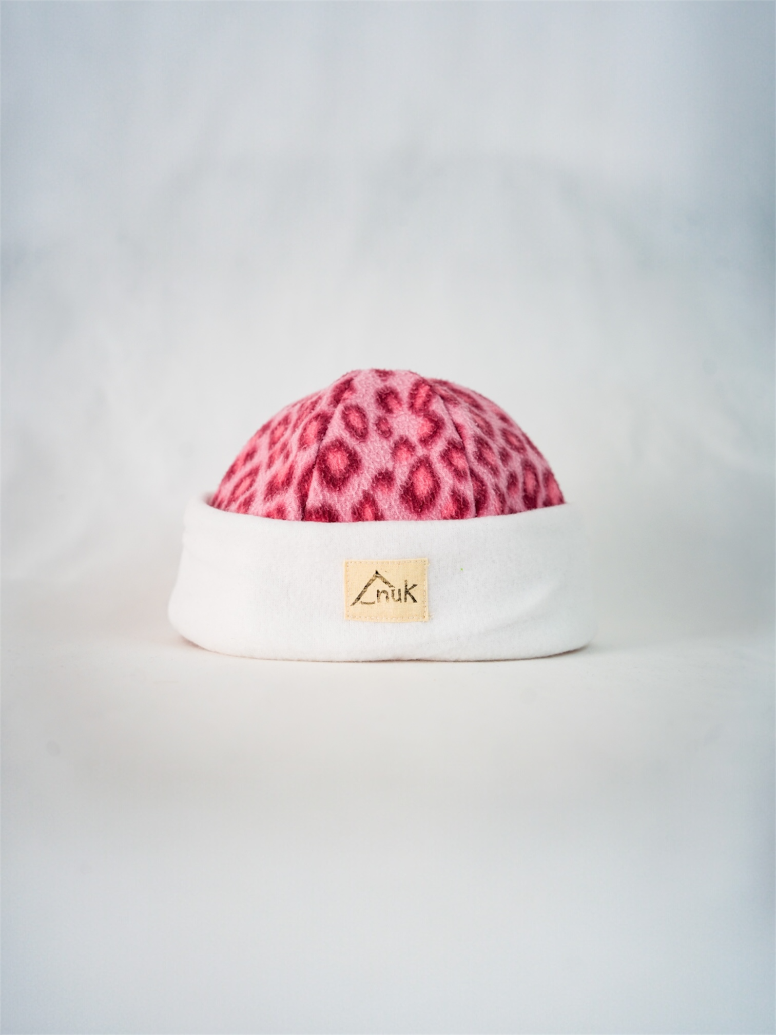 Bonnet blanc & léopard rose